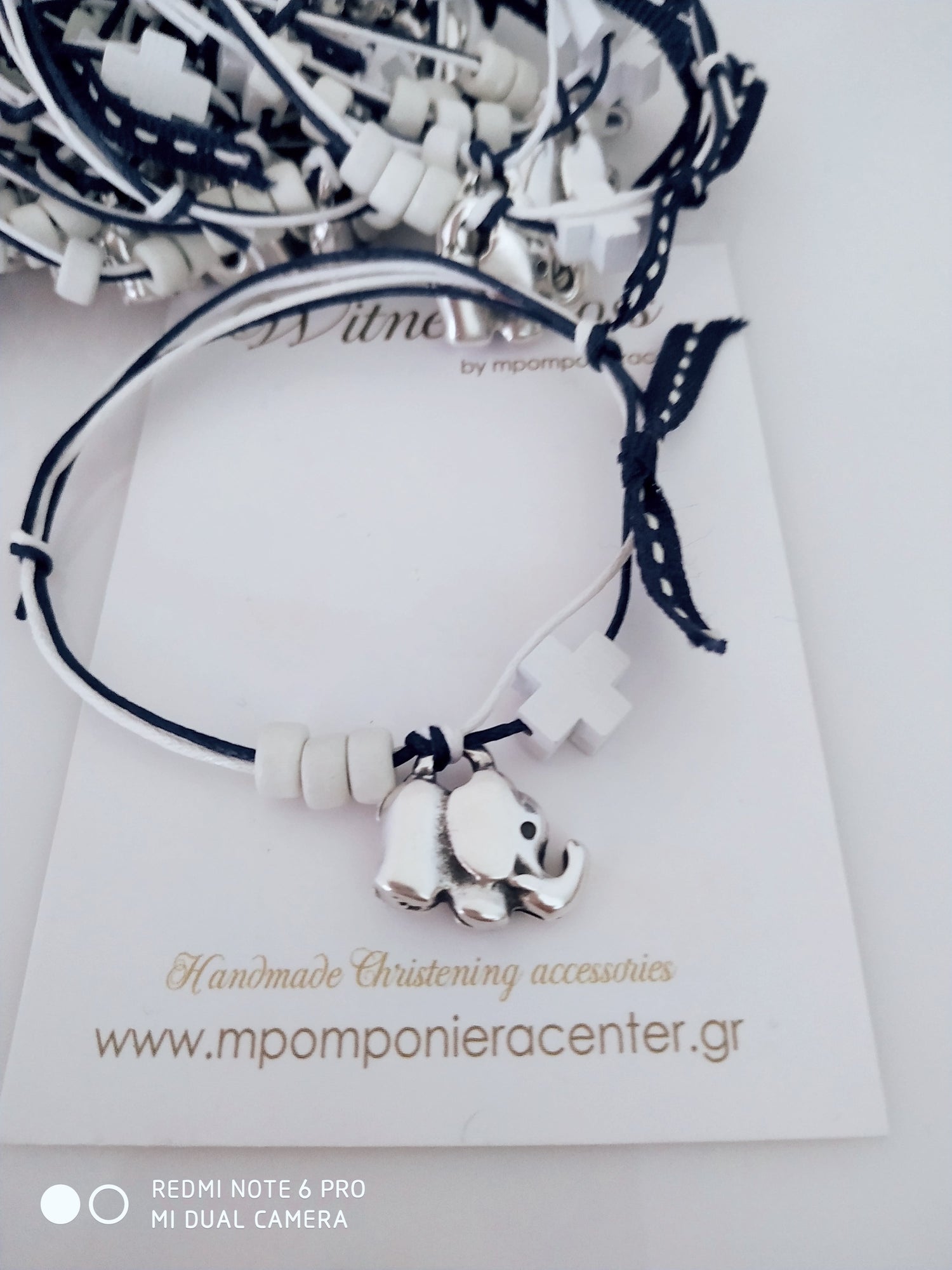 Μαρτυρικό βραχιόλι με διπλό κορδόνι , ξύλινο σταυρό και μεταλλικό ελεφαντάκι 