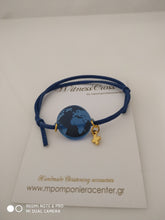 Μαρτυρικό βραχιόλι κόσμος με την γη , σε μπλέ plexiglass και σουέντ κορδόνι
