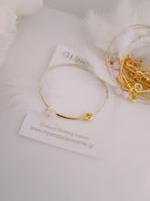 Μαρτυρικό βραχιόλι με ιδιαίτερο σταυρό , πούπουλο, κρεμαστή μπίλια ροζ,  περαστό σταυρό σε χρυσό