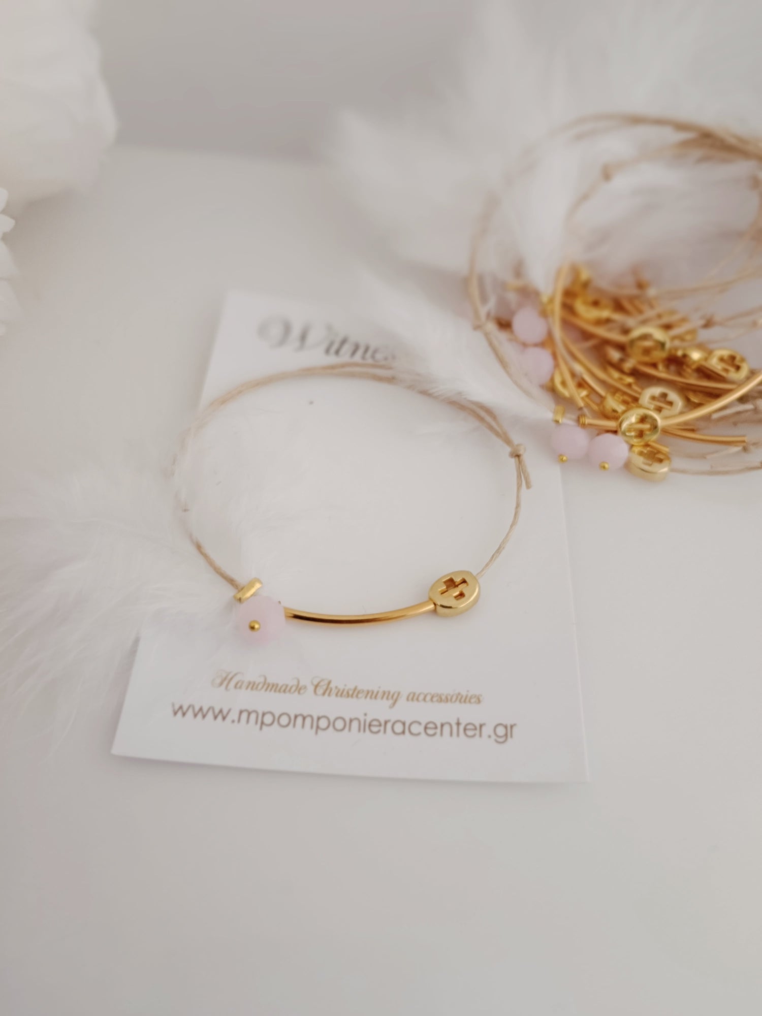 Μαρτυρικό βραχιόλι με ιδιαίτερο σταυρό , πούπουλο, κρεμαστή μπίλια ροζ,  περαστό σταυρό σε χρυσό