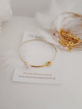 Μαρτυρικό βραχιόλι με ιδιαίτερο σταυρό , πούπουλο, κρεμαστή μπίλια ροζ,  περαστό σταυρό σε χρυσό