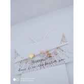 Μαρτυρικό λευκό με χάντρες γαλάζιες και ροζ (δημιουργήθηκε για δίδυμα) με αστεράκι και σταυρό