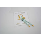 Μαρτυρικό μπρελόκ με σταυρό ματάκι και ιδιαίτερος ακροδέτες στο τελείωμα με ουρά γοργόνας