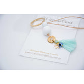 Μαρτυρικό μπρελόκ με αστεράκι και ματάκι στο πλάι , ιδιαίτερο σταυρό & φούντα βεραμάν
