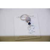 Μαρτυρικό μπρελόκ με ελεφαντάκι plexiglass και σταυρό χαντρούλα , αποχρώσεις ασημί μπλέ σκούρο