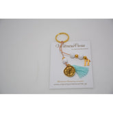 Μαρτυρικό μπρελόκ Κωνσταντινάτο μονής όψης με χαντρούλες  λευκές,  φουντίτσα βεραμάν & μονόγραμμα