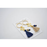 Μαρτυρικό μπρελόκ με ματάκι στο πλάι , ιδιαίτερο σταυρό & φούντα μπλέ σκούρα (navy) ή μπέζ