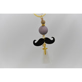 Μαρτυρικό μπρελόκ μουστάκι σε γκρι μαύρες αποχρώσεις , με φουντίτσα λευκή