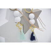 Μαρτυρικό μπρελόκ με ματάκι στο πλάι , ιδιαίτερο σταυρό & φούντα βεραμάν