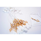 Μαρτυρικό μπεγλέρι σε αποχρώσεις λευκό-μπεζ με ιδιαίτερο σταυρό και φουντίτσα