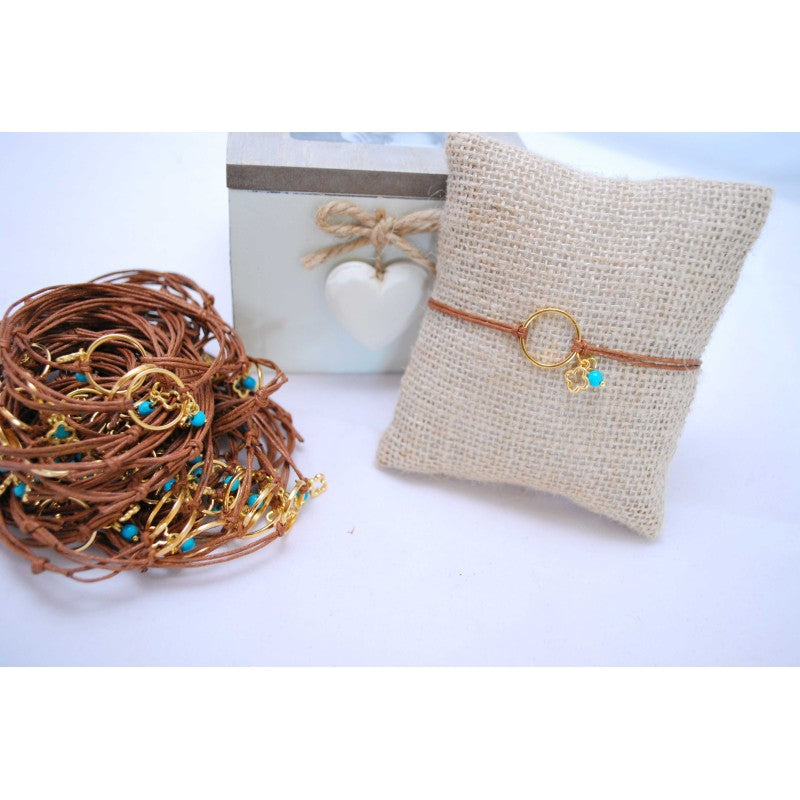 Μαρτυρικό με κύκλο μεταλλικό , σταυρό και ματάκι στο πλάι και ημιπολύτιμο πέτρωμα τυρκουάζ χαντρούλα