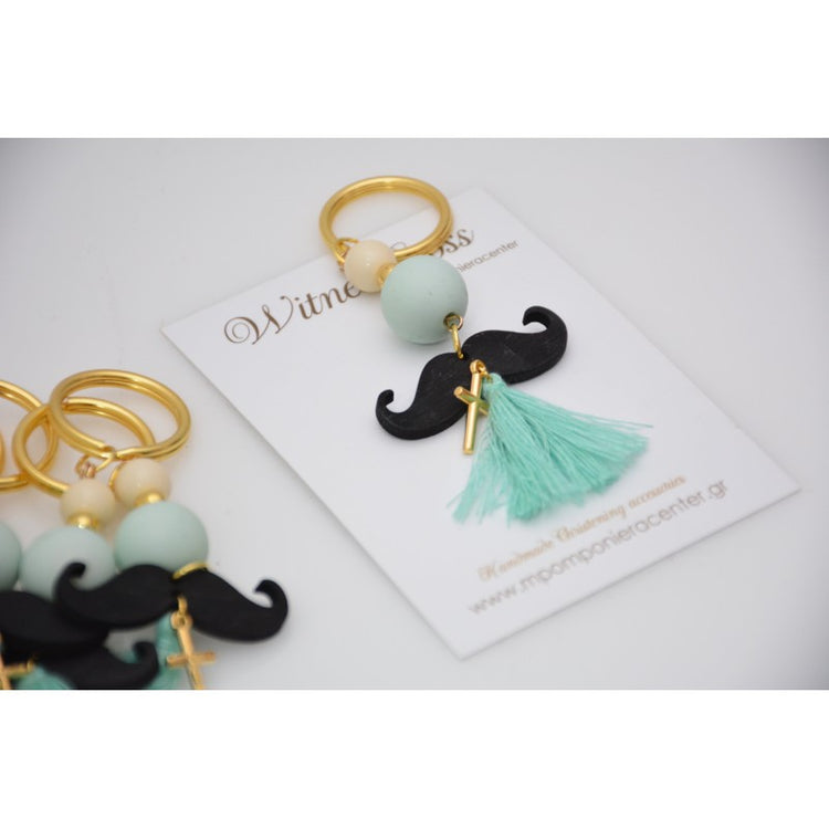 Μαρτυρικό μπρελόκ μουστάκι σε βεραμάν εκρού αποχρώσεις , με φουντίτσα βεραμάν