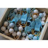 Μαρτυρικό μπρελόκ με λευκές -σιέλ χάντρες και σταυρό χρυσό