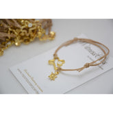 Μαρτυρικό με ιδιαίτερο μεταλλικό σταυρό ματάκι στο πλάι με κρεμαστή χελωνίτσα