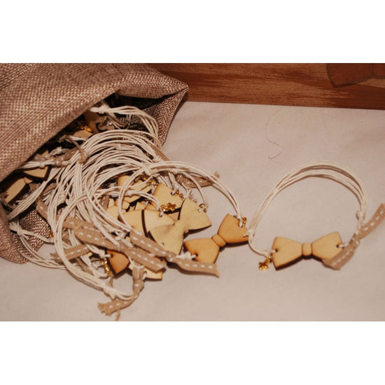 Μαρτυρικό παπιγιόν βραχιόλι ξύλινο & μεταλλικό σταυρό σε μπεζ κερωμένο κορδόνι