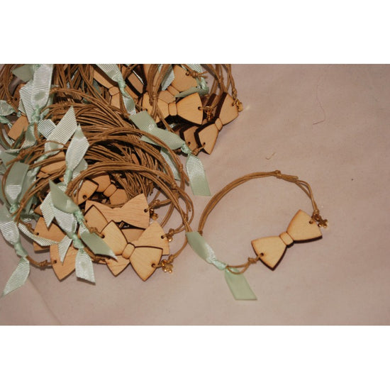 Μαρτυρικό παπιγιόν βραχιόλι ξύλινο & μεταλλικό σταυρό σε βεραμάν αποχρώσεις