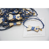 Μαρτυρικό παπιγιόν βραχιόλι ξύλινο με ματάκι και χάραξη το όνομα του παιδιού