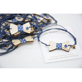 Μαρτυρικό παπιγιόν βραχιόλι ξύλινο με ματάκι και χάραξη το όνομα του παιδιού