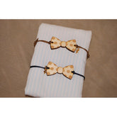 Μαρτυρικό παπιγιόν βραχιόλι ξύλινο με χάραξη πουά με χρυσό σταυρό