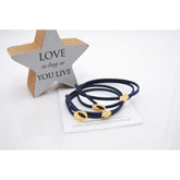 Μαρτυρικό βραχιόλι με ιδιαίτερο σουέτ κορδόνι , περαστό σταυρό και κούμπωμα