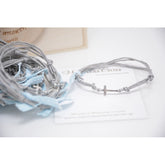 Μαρτυρικό βραχιόλι με ασημί σταυρό, γκρι κορδόνι και σιέλ κορδέλα