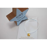 Μαρτυρικό βραχιόλι με μεταλλικό σταυρό & σουέτ κορδόνι λευκό