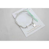 Μαρτυρικό βραχιόλι με αστερία σε γκρί κορδόνι και διακοσμητική κορδέλα βεραμάν