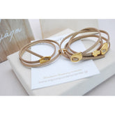 Μαρτυρικό βραχιόλι με ιδιαίτερο σουέτ κορδόνι , περαστό σταυρό και κούμπωμα