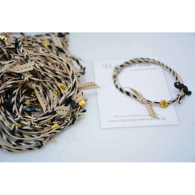 Μαρτυρικό βραχιόλι με μουστάκι σε μαύρο με μεταλλικό σταυρό με μαύρες αποχρώσεις.