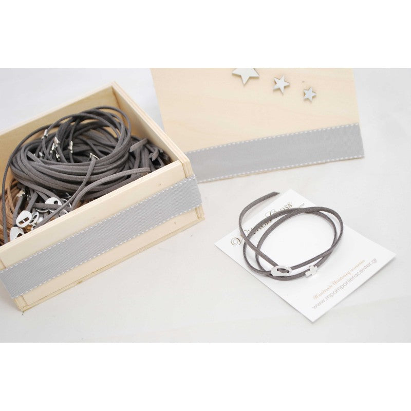 Μαρτυρικό βραχιόλι με ιδιαίτερο σουέτ κορδόνι , περαστό σταυρό και κούμπωμα σε ασημί