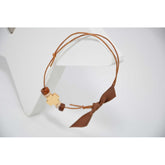 Μαρτυρικό βραχιόλι μπεζ  με ξύλινο σταυρό & χάντρες σε καφέ -μπεζ