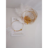 Μαρτυρικό βραχιόλι με ιδιαίτερο δέσιμο , πούπουλο, κρεμαστή μπίλια ροζ,  περαστό σταυρό σε χρυσό