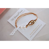 Μαρτυρικό βραχιόλι με ξύλινο σταυρό και πέρλες