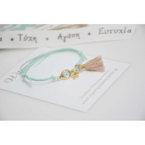 Μαρτυρικό βραχιόλι με ιδιαίτερο ματάκι και σταυρό στο πλάι με φουντίτσα