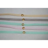 Μαρτυρικό βραχιόλι σε βεραμάν, γκρι, ροζ ή μπεζ με ιδιαίτερο περαστό σταυρό σε χρυσό