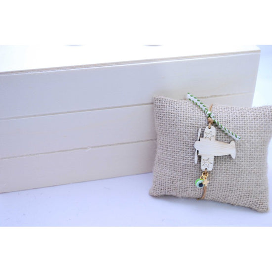 Μαρτυρικό βραχιόλι με ξύλινο αεροπλανάκι , ματάκι και σταυρό μεταλλικό