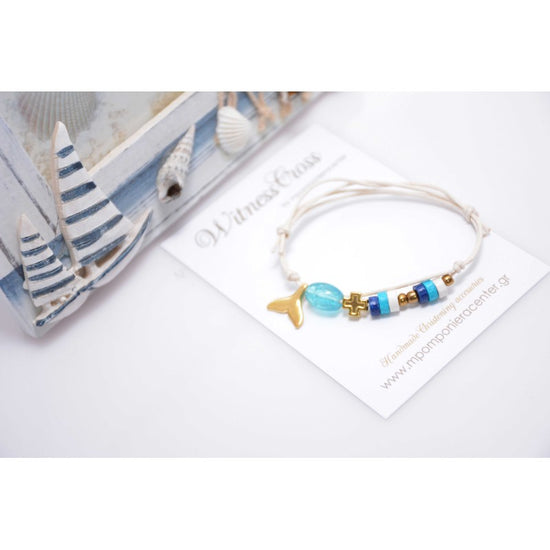 Μαρτυρικό βραχιόλι με ουρά γοργόνα, χάντρες, περαστό σταυρό χρυσό  & χάντρες σε σιέλ λευκό