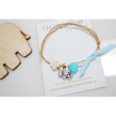 Μαρτυρικό βραχιόλι με διπλό κορδόνι , ξύλινο σταυρό και μεταλλικό ελεφαντάκι