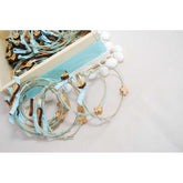 Μαρτυρικό βραχιόλι με κρητική λύρα σε σιέλ-μπεζ αποχρώσεις